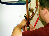 John is working on a water heater repair in San Marcos